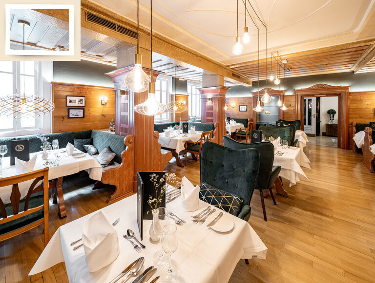 Ein gemütlicher Essbereich mit edlen gedeckten Tischen in der Schwarzwaldstube des Hotelrestaurants Holzapfel in Bad Füssing.